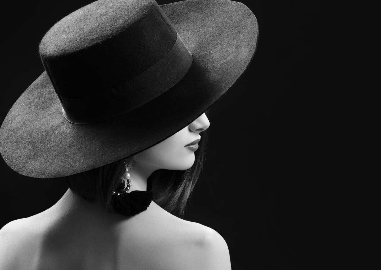 attractive-woman-wearing-hat-posing-black-background-1.jpg